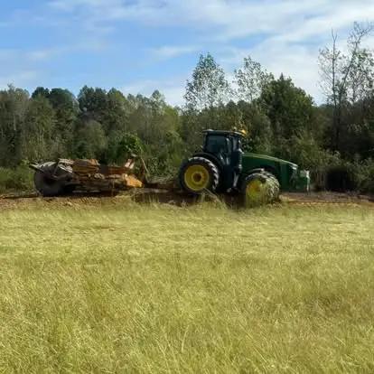 Site development equipment clearing and leveling ground.